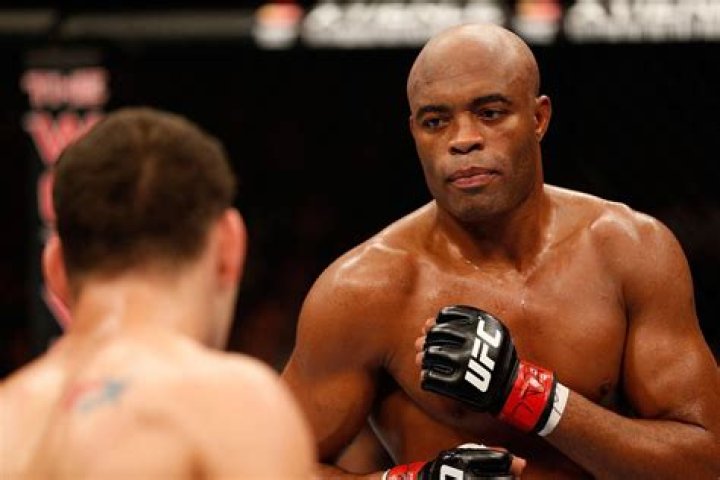 Anderson Silva posing with his Mercedes.