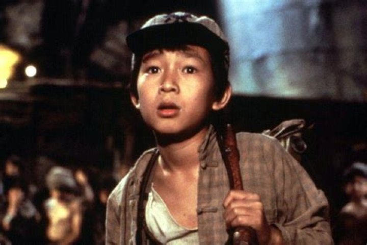 Ke Huy Quan as Short Round riding an elephant in Indiana Jones
