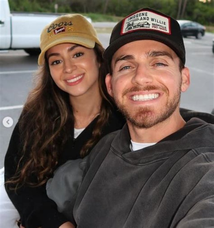 Talia Scott and her husband, Roger Scott posing for a photo shoot.